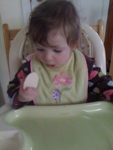 Almost feeding herself